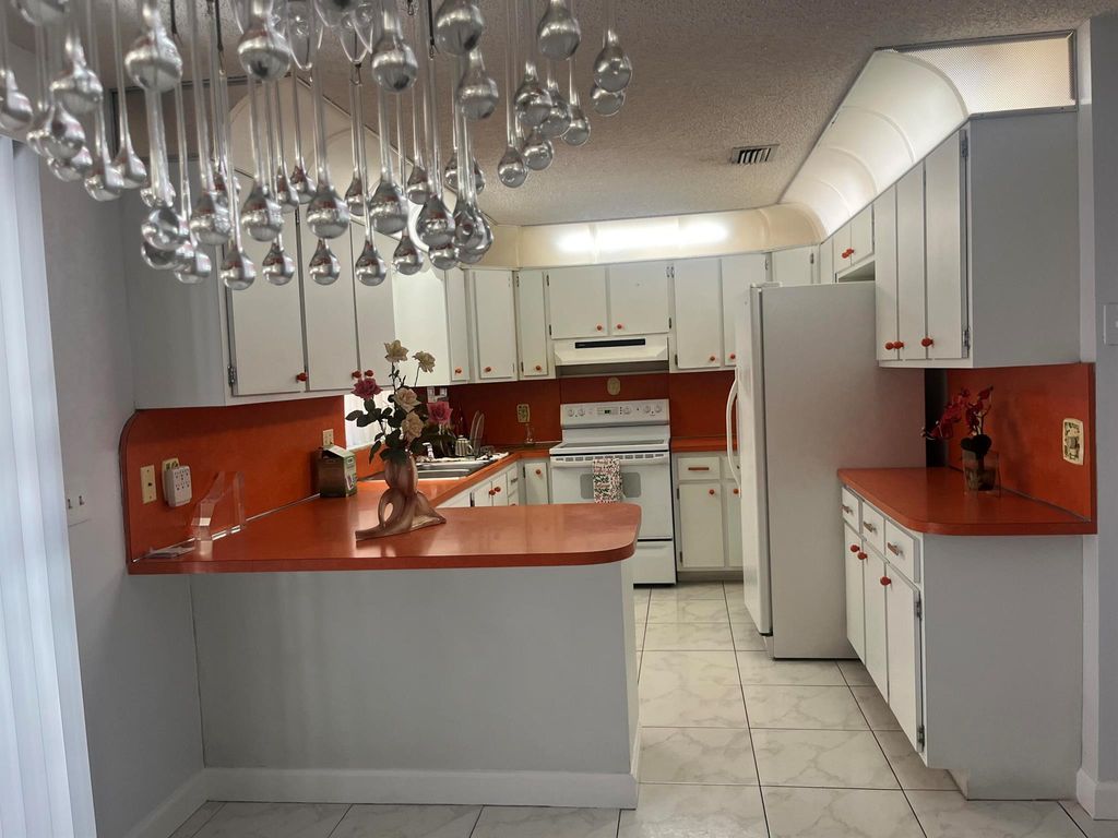 Photo of 820 W Lakewood Road, West Palm Beach, FL 33405 (MLS # R11142421)