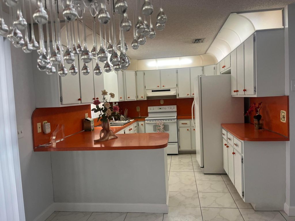 Photo of 820 W Lakewood Road, West Palm Beach, FL 33405 (MLS # R11142421)