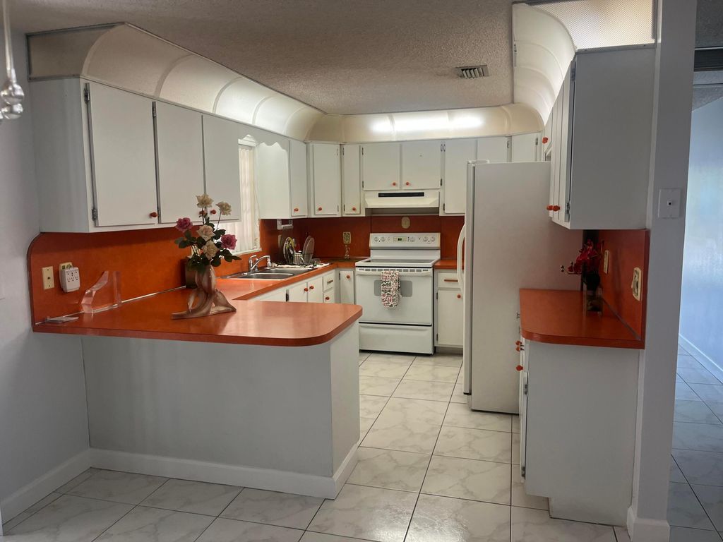 Photo of 820 W Lakewood Road, West Palm Beach, FL 33405 (MLS # R11142421)