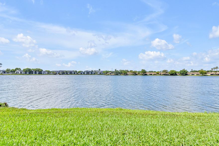 Welcome to this amazing slice of Florida Living.  This is a wonderful 2 bedroom 2 bath oasis with a stunning view of the lake - come take your morning coffee on the patio overlooking the lake.  This property has an updated guest bathroom and tile throughout the property and more importantly IMPACT SLIDING GLASS DOORS AND WINDOWS!! Moving in ready!!  The association has plenty of reserves so you only need 5% for the loan!! Come on down and let's make this happen!