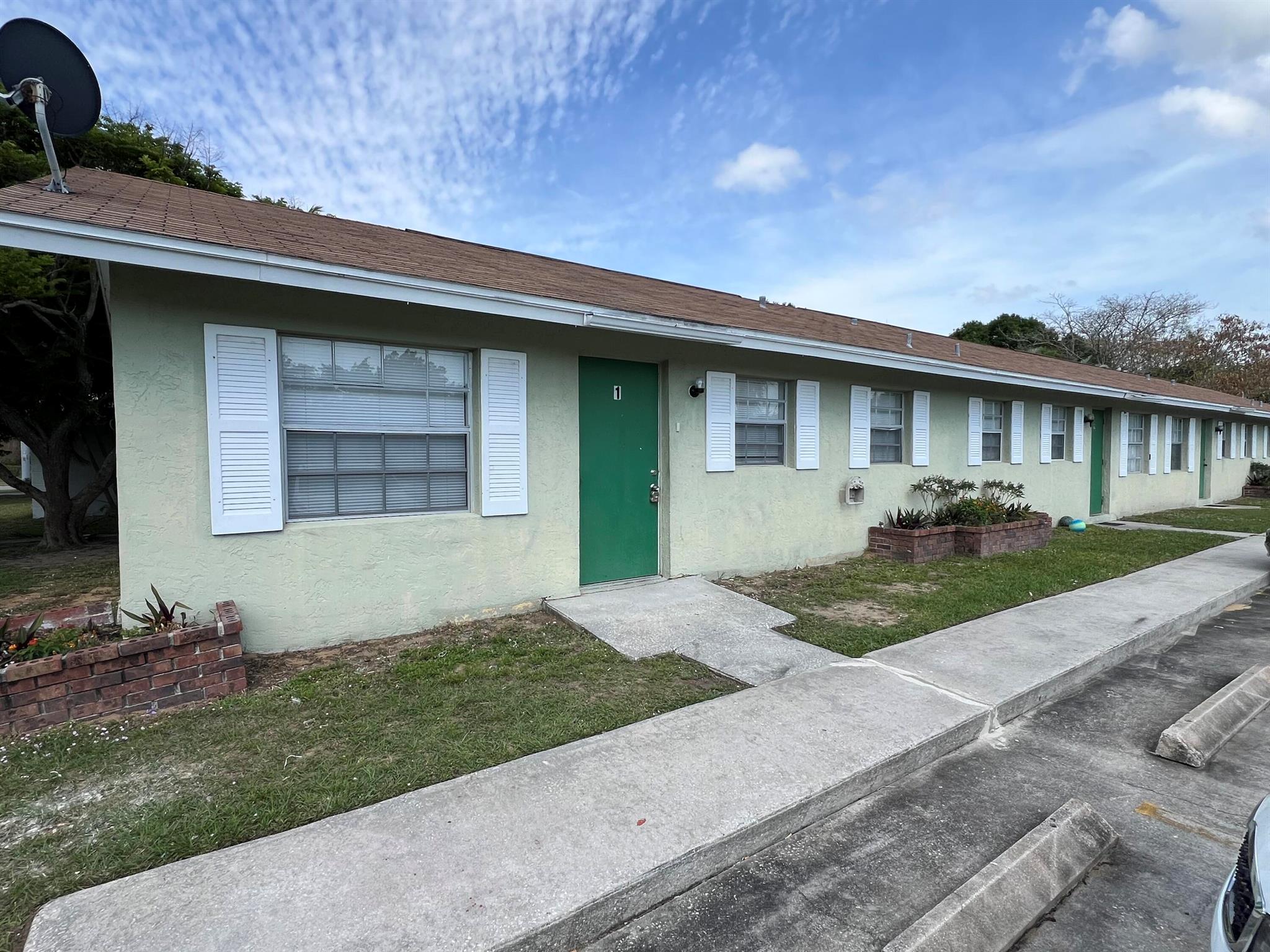 First floor large 2/1 apartment. Ready to move in. Tile throughout unit. freshly painted, new blinds, kitchen cabinets, new appliances. Close to shopping, schools, downtown Vero Beach and beaches. Water, trash, and lawn care included, with coin operated laundry on premise.