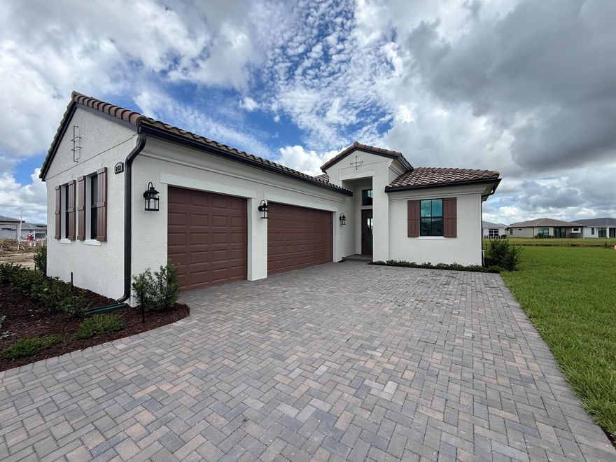 Brand New Lila in PGA Verano. 4 bedrooms, 3 full baths + 3 car garage sitting on a breathtaking oversized ;lot on the most perfect cul-de-sac in the community. Primary suite overlooks the lake, has beautiful ensuite w/ dual sinks, spacious tiled shower w/ glass door & huge walk-in closet! Three more bedrooms, one with private ensuite and the others with access to the guest bath! Chef kitchen with 36 inch range hood/induction cooktop.  Verano is a resort-style, amenity-packed community offering something for everyone! 27-court pickleball facility, scenic walking trails, indoor and outdoor pools, multiple fitness centers, sauna, dog park, resistance pool, e-gym, tennis courts, a vibrant social clubhouse, and so much more. HOA fees cover cable, internet and lawn care.