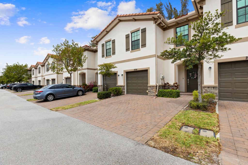 Photo of 1004 Sweet Briar Lane, Riviera Beach, FL 33410 (MLS # B26014005)