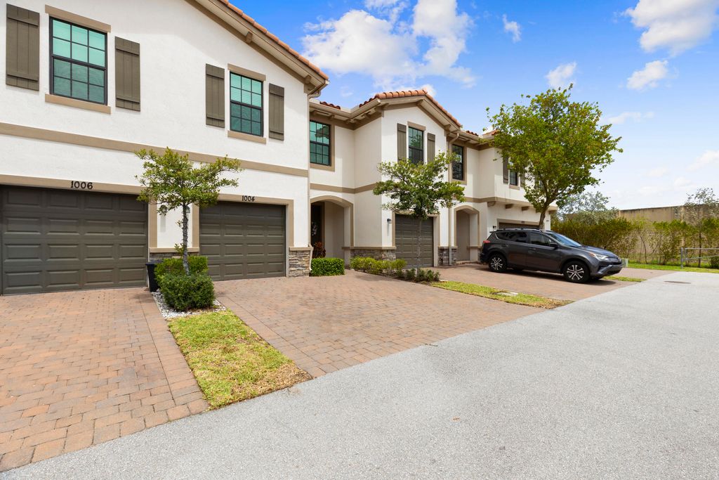 Photo of 1004 Sweet Briar Lane, Riviera Beach, FL 33410 (MLS # B26014005)