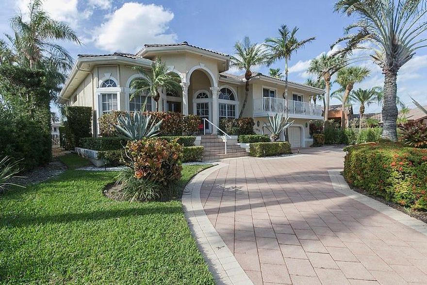 Spectacular Sweeping Views across the Intracoastal Waterway to the Multi Million Dollar Homes of Bay Colony.  112 Feet of Frontage with Updated seawall, Evergrain Dock, 24,000 LB Boat Lift, Seperate Jet Ski Lift.  Oversized 1/4 acre lot.  Whole House Generator Installed 2020. Year Built States 1960 but Construction was 1993 For Second Story.  Three Zone A/C Units all replaced since 2021.  New Insulation installed in Attic 2022.   Main Level living area with High Volume Ceilings.  Most Windows and Sliders Changed to Impact.   Some Shutters.  Expansive Patio area.  City Gas Available.  4 Foot Crawl Concrete Storage access from Garage and Laundry under half of the home.  Sq Footage and Year Built Discrepency on BCPA .  Oversized Garage 27 x 29.