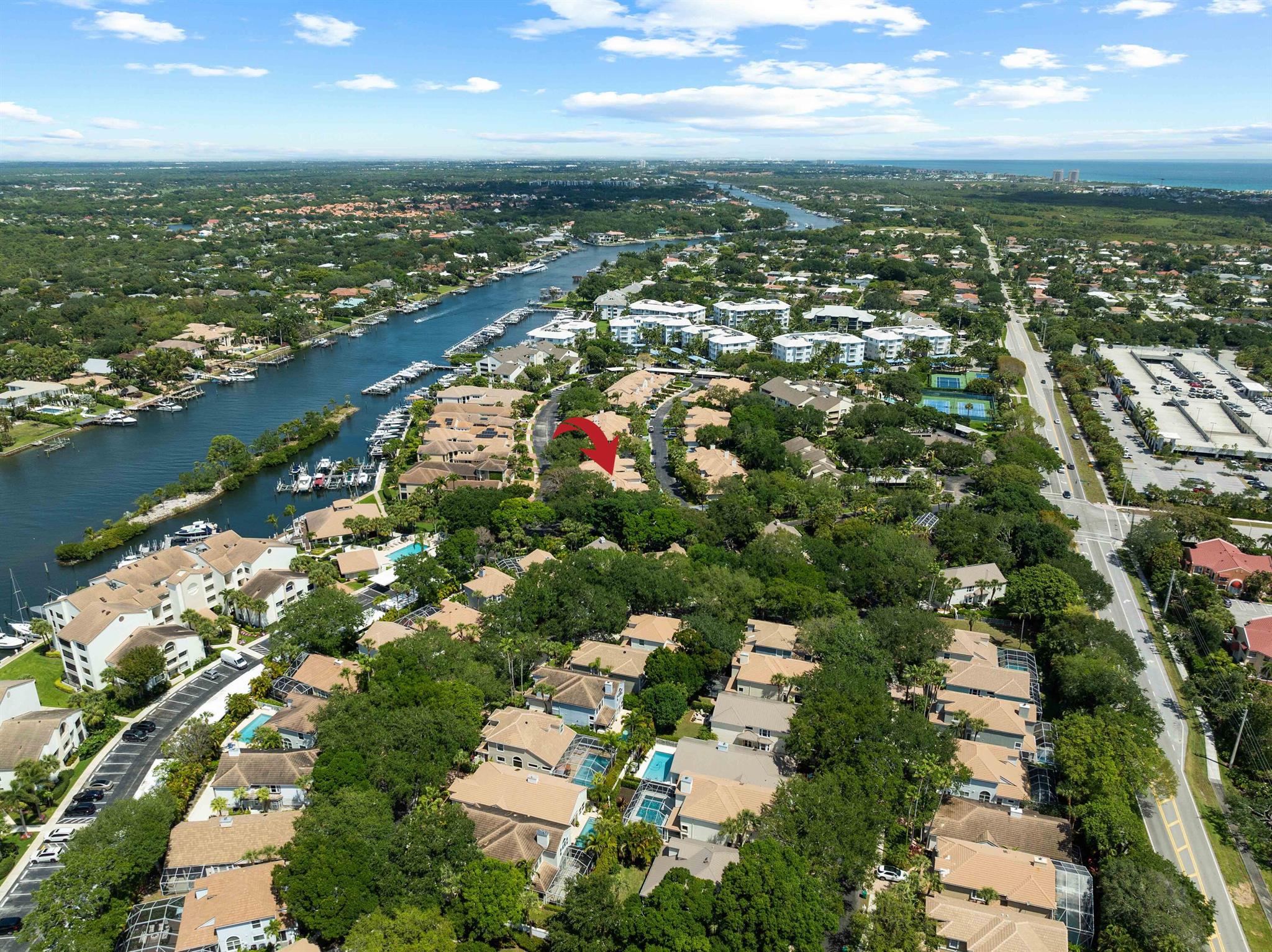 Welcome to this beautifully updated 3-bedroom, 2.5-bath townhome in the gated Intracoastal community of Oak Harbour in Juno Beach. Rarely available, this spacious residence lives like a single-family home with a 2-car garage, enclosed porch, inviting living spaces, and a private, lushly landscaped courtyard. Recent upgrades include a new roof (2022), impact glass hurricane windows and garage door, beautiful hardwood flooring throughout, and tastefully renovated bathrooms. Additional interior updates include remodeled bathrooms, fresh coastal paint throughout, redone and modernized stairs, plantation shutters, a private and spacious backyard, and a 2023 water heater. The kitchen features newer stainless steel appliances. Additional highlights include soaring ceilings, generous closet