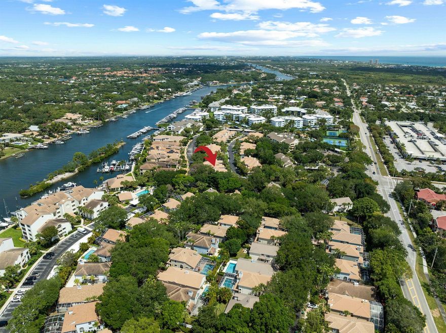 Welcome to this beautifully updated 3-bedroom, 2.5-bath townhome in the gated Intracoastal community of Oak Harbour in Juno Beach. Rarely available, this spacious residence lives like a single-family home with a 2-car garage, enclosed porch, inviting living spaces, and a private, lushly landscaped courtyard. Recent upgrades include a new roof (2022), impact glass hurricane windows and garage door, beautiful hardwood flooring throughout, and tastefully renovated bathrooms. Additional interior updates include remodeled bathrooms, fresh coastal paint throughout, redone and modernized stairs, plantation shutters, a private and spacious backyard, and a 2023 water heater. The kitchen features newer stainless steel appliances. Additional highlights include soaring ceilings, generous closet