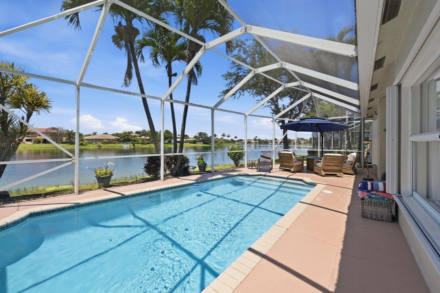 Stunning 4BR/2BA waterfront pool home in coveted Pelican Trail East. A brand new roof, new A/C, and a refined split floor plan elevate this beautifully maintained residence. The moment you enter, breathtaking lake views frame the living and dining rooms, creating a true luxury arrival. Enjoy seamless indoor outdoor living with a screened pool overlooking the water. Low fee HOA includes lawn care and the community offers top rated schools.