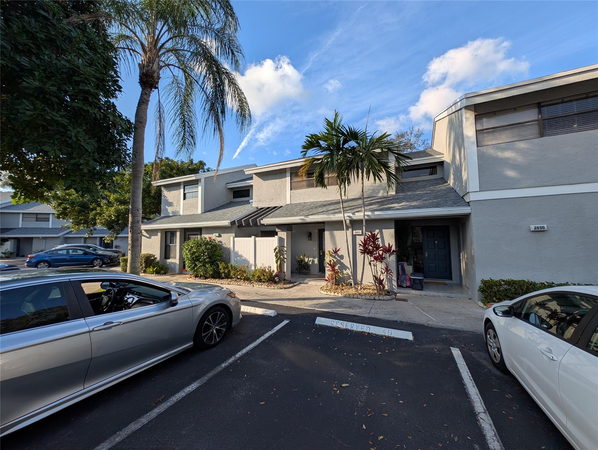 Welcome home to this spacious 3-bedroom, 2.5-bath townhome in a lakeside community within the highly sought after Township! Minor updates needed. Home features an open-concept layout, granite countertops, with tile and carpet throughout. Enjoy tranquil garden views from your enclosed patio—perfect for a home office or relaxation. The large primary suite boasts a walk-in closet and en-suite bath, while the two additional bedrooms offer plenty of space. With two parking spaces right outside and a new roof already paid for and installed, this home is truly turn-key! The Township offers incredible amenities, including a swimming pool, tennis courts, fitness center, picnic areas, and more. Conveniently located near highways, shopping, dining, and just minutes from Pompano Beach.