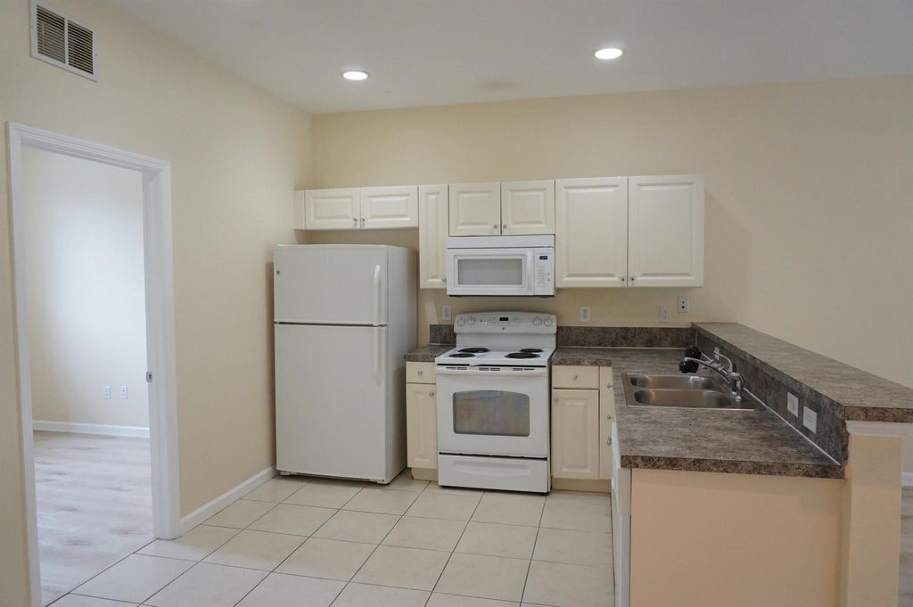 Photo of 1931 Marsh Harbor Drive, Riviera Beach, FL 33404 (MLS # R11129033)