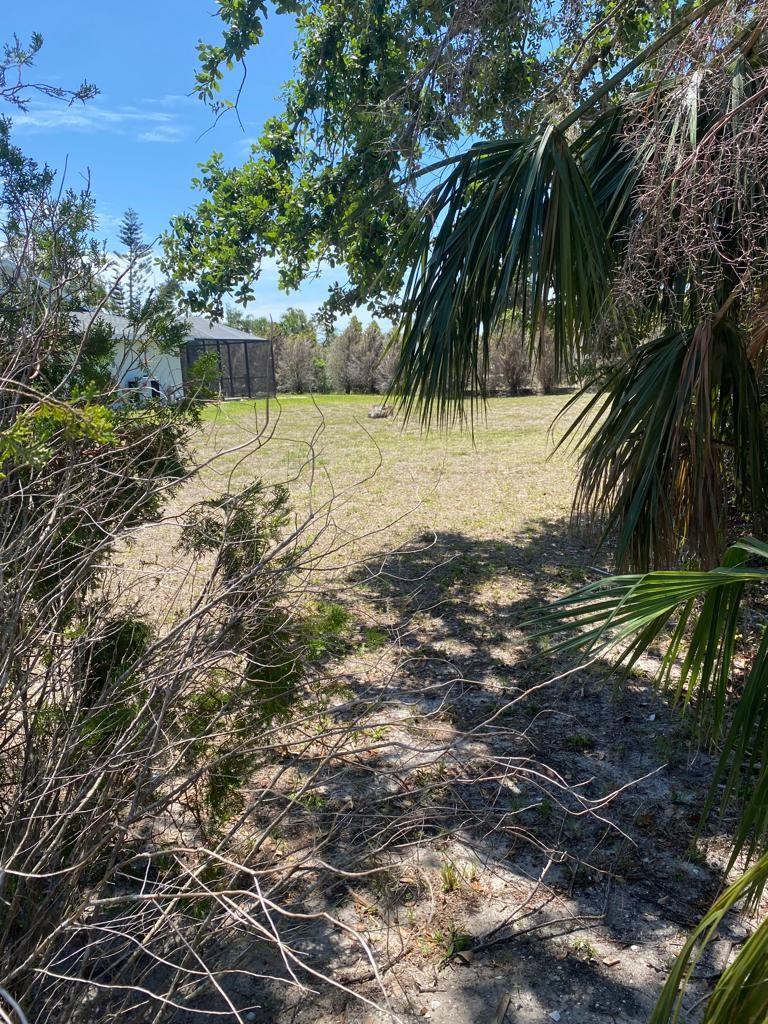 The vacant lot is a prime 0.17-acre property. Situated in the tranquil and expanding community of Rotonda West, this lot offers an ideal location for constructing your dream home. The area is known for its peaceful streets and welcoming atmosphere. For those seeking more space, the adjacent lot is also available, allowing for the possibility of expanding and building a larger home for enhanced privacy and comfort. The lot is nearly clear, with only a few small pine trees at the front and back, simplifying the building process.