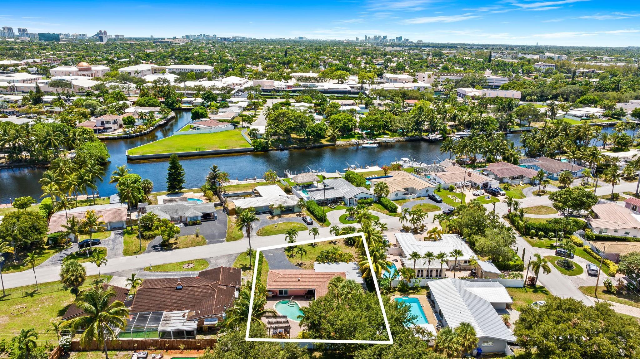 Move-in ready and full of charm, this 3-bedroom, 2-bath single-family home is located in a desirable East Pompano Beach neighborhood just minutes from the beach and entertainment. This home features Hurricane-Impact Windows, neutral tile flooring throughout, and a split-bedroom layout for added privacy. The spacious interior includes an open living area, a well-equipped kitchen with plenty of storage, and an interior laundry room with built-in cabinetry and washer/dryer. Outside, enjoy your own private oasis with a lushly landscaped fenced yard, a sparkling pool, and a driveway offering ample parking. No HOA. Conveniently located near major highways, golf, and the vibrant Pompano Beach Pier district. Ideal as a primary residence, vacation home, or investment opportunity.