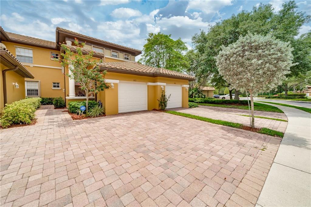 This gorgeous 3-bed, 2-bath coach home located in the desirable Heron Bay community. Boasting an open split floor plan with high ceilings and abundant natural light, this corner upstairs unit features modern upgrades including a new A/C, water heater, plantation shutters, security system, and a built-in wine cooler. Relax in the master suite's walk-in shower or enjoy the serene lake view from the screened balcony. One bedroom offers a private wing for added privacy, while the other can be used for whatever suits your needs. Plus, with a brand-new full size Samsung washer and dryer. Amenities include 3 guarded gates, tennis courts, pickleball, basketball, swimming pools, fitness centers, activities/events and more. All of this, plus top-rated A schools.