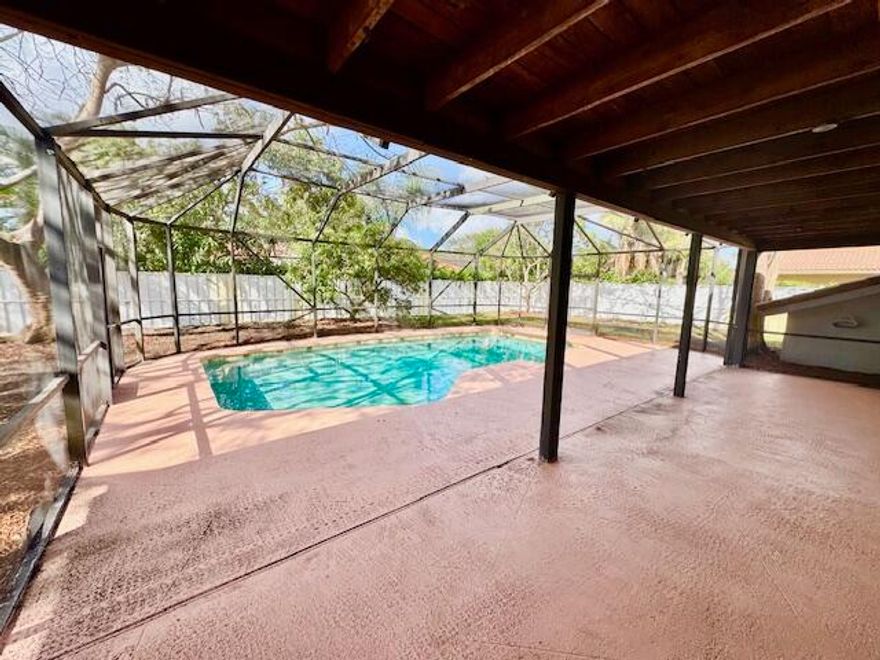 Beautifully upgraded home on an oversized, private interior lot. Features include 18x18 tile flooring, updated bathrooms, stainless steel appliances, Anderson French doors, hurricane-impact garage door, windows, hurricane shutters, and a storage shed. Enjoy a circular driveway and an oversized pool and patio with wet bar, perfect for entertaining. No HOA. Conveniently located near schools, shopping, parks, and easy access to the Turnpike. New Flat roof, AC 2023,roof 2003,Newer Water heater.