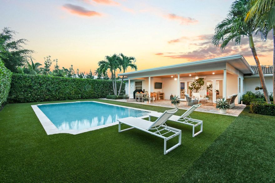 This beautifully maintained, move-in ready home is located on a prime lake block East of Olive in the desirable ''SOSO'' neighborhood. The open floor plan is perfect for entertaining, featuring a high-end kitchen that flows into spacious living and dining areas. The single-level layout offers a private split-bedroom design with a serene primary suite and guest rooms on the opposite side. Impact windows and a convenient laundry and mudroom connect to the 2-car garage. Outside, enjoy a covered loggia overlooking the pool, lush landscaping, and newly installed turf, ideal for entertaining. Minutes from beaches, restaurants, and Worth Avenue, this turn-key property is a rare find.