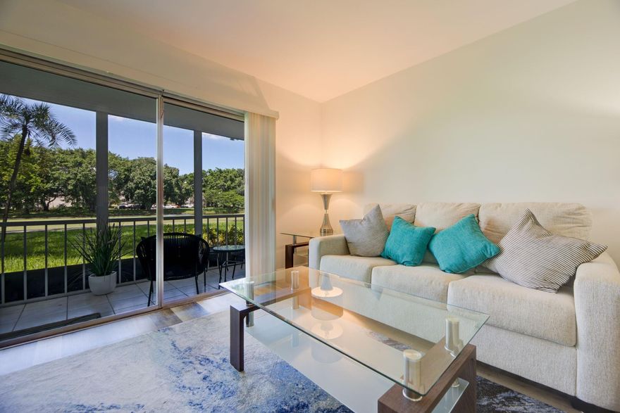 AMAZING AND UPDATED 1st FL. ONE BEDROOM CONDO WITH A WONDERFUL WATER & GOLF VIEW! Spacious condo has an updated kitchen and bathroom with granite countertops, new cabinets, flat ceiling (no popcorn) and pass through in kitchen. All Kitchen appliances and AC less than two years old! Water heater is 8 years old. GORGEOUS COLORFUL LAMINATE FLOORING THROUGHOUT THE CONDO. NO CARPETS! HUGE PATIO TO SIT ON WITH YOUR MORNING COFFEE OR SIPPING WINE AT SUNSET LOOKING AT YOUR BEAUTFUL LANDSCAPED AREA LEADING TO YOUR WATER VIEW!  SOME FURNITURE NEGOTIABLE. WYNMOOR has many amenities like a restaurant on site, golf, FREE BASIC CABLE TV, Tennis, exercise facility, free buses, PICKLEBALL, Billiards, POOLS, BAR-B-QUES, ARTS & CRAFTS WORKSHOPS & MUCH MORE. SELLER MOTIVATED!  BRING ALL OFFERS!!