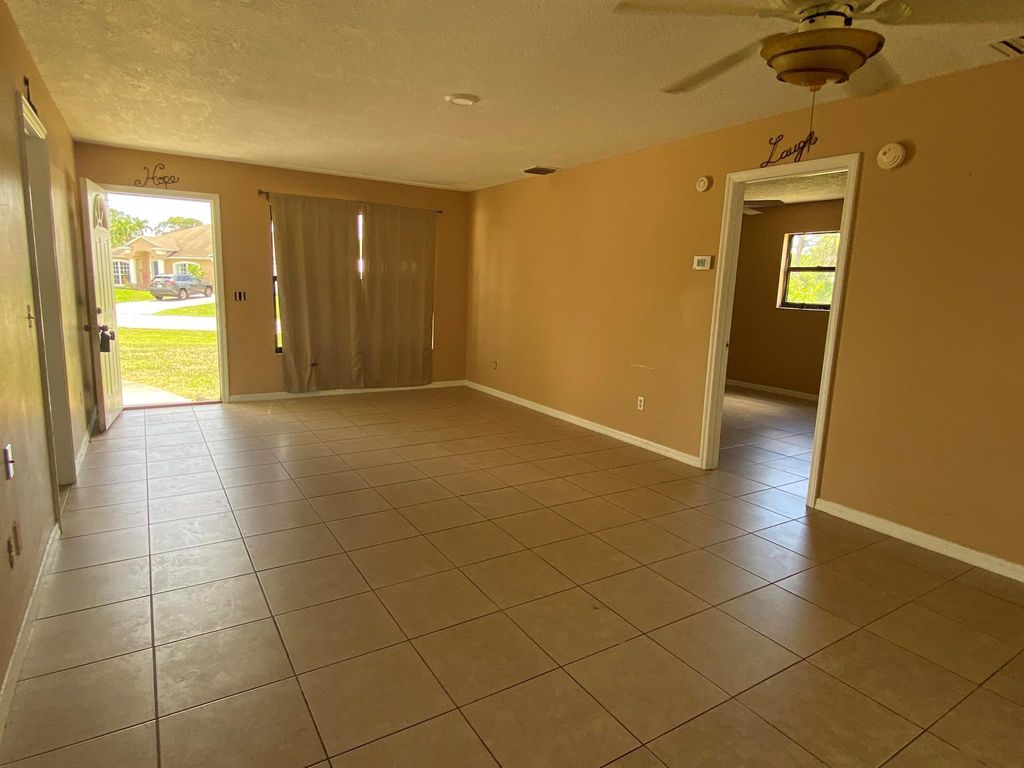 Photo of 601 SE Polynesian Avenue, Port Saint Lucie, FL 34983 (MLS # R11004317)