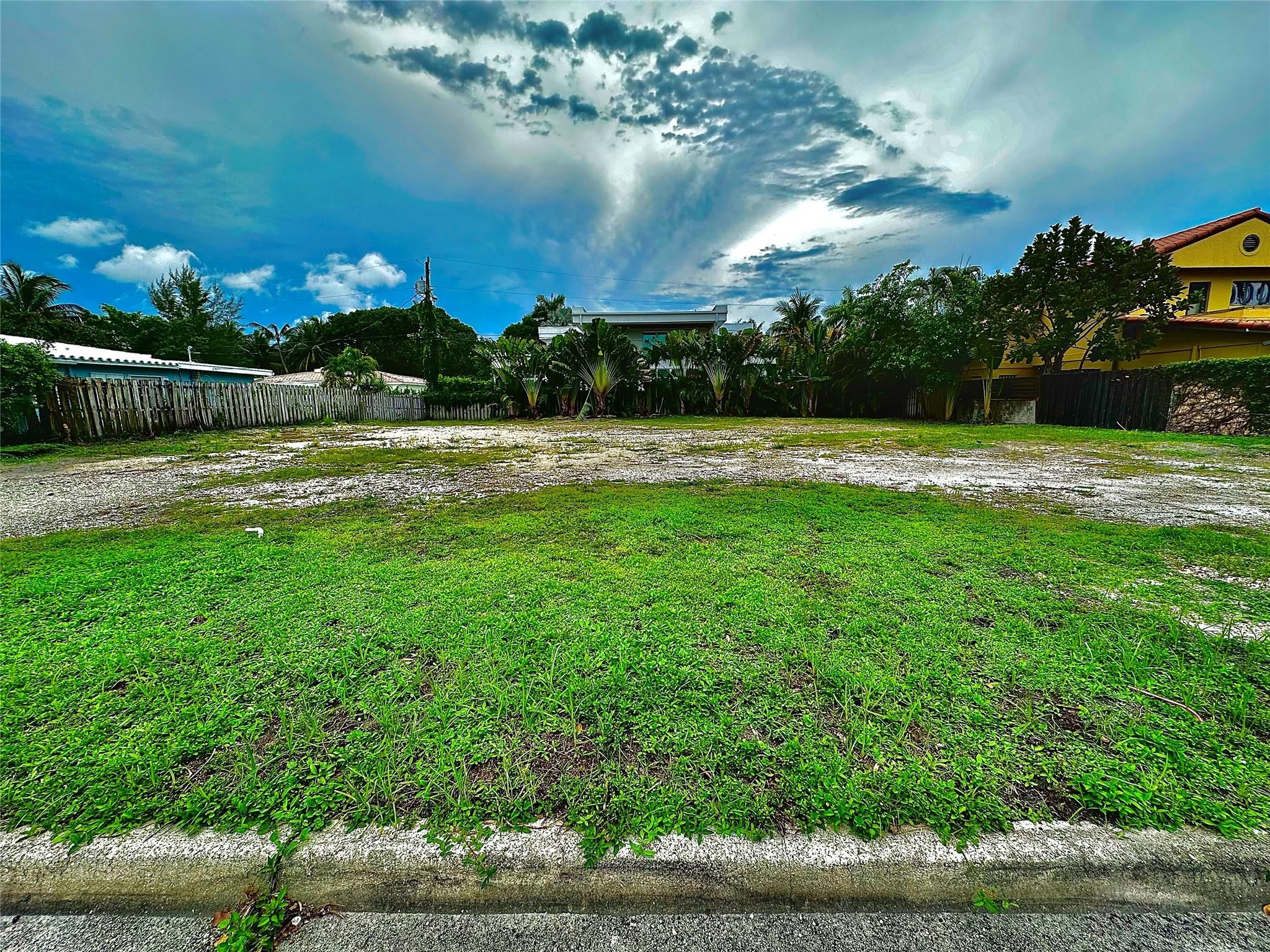 Vacant Building Lot Ready Now Available for Purchase on the Best Street in Old Coral Ridge. NE 18th Street Heading East from Bayview Drive was the Original Marquee Entrance to Coral Ridge When it was Platted 80 Years Ago. The Street is 15' Wider Than All Other Side Streets, and the Only Street in the East with Actual Curbs and Gutters. Drive By and See for Yourself! A Rare Chance to Build on a 100' Landmark Site.