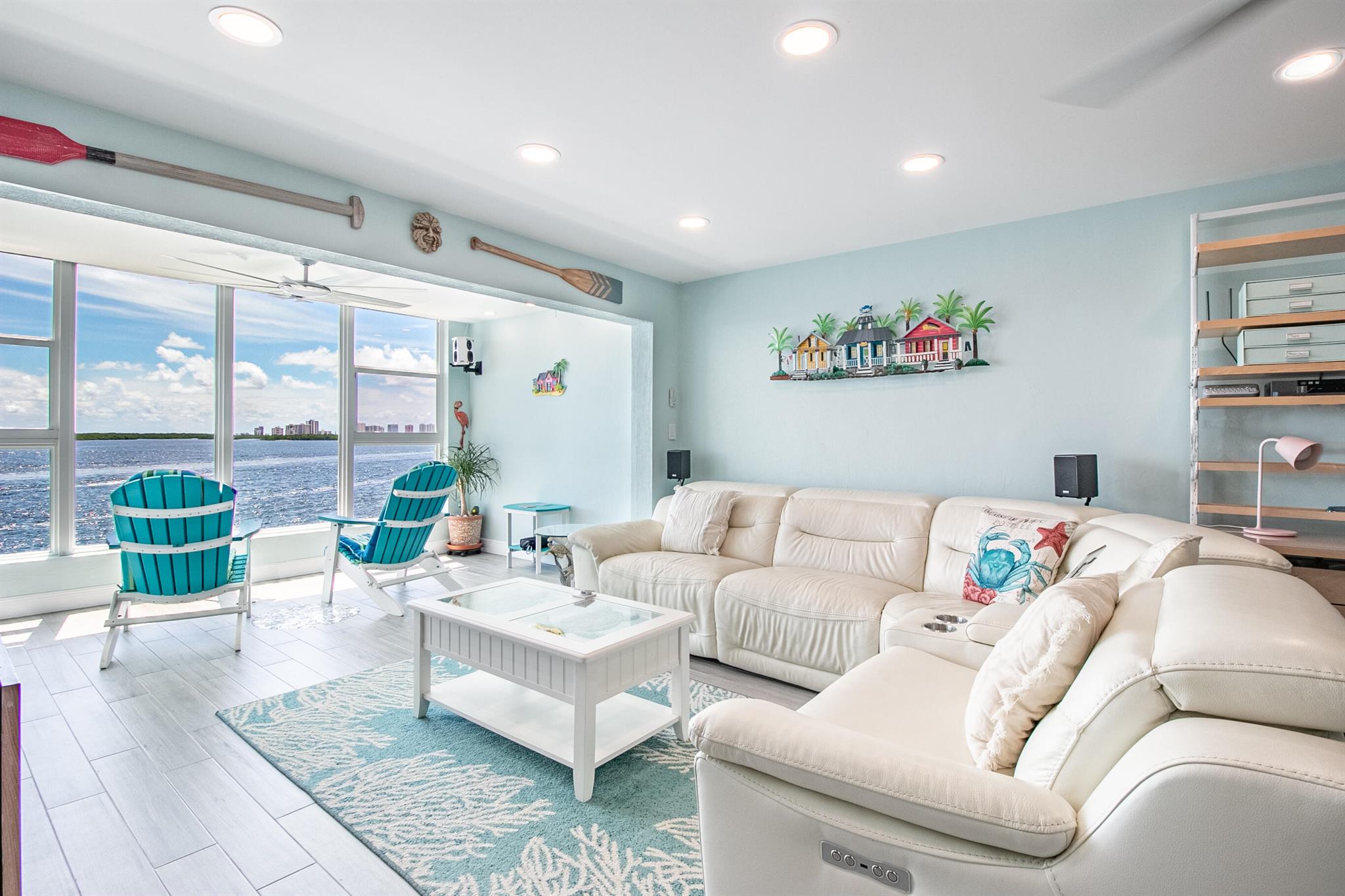 Beautifully updated unit with fabulous wide open intracoastal views. Age restricted community. New wood look tile flooring in living areas and high quality wood plank flooring in bedrooms, updated kitchen and bathrooms. Walk-in closet with slide out shelving. High hat lighting and top quality ceiling fans. Smart lights and thermostat can be programmed, voice activated or used manually. Reverse osmosis water treatment system. Hurricane resistant windows and front door. In addition to hurricane resistant glass, windows have added protection of electric roll down hurricane shutters. Shutters are so easy to use they can also be utilized for window shades. A/C unit is 2019. Condo association passed SIRS and milestone inspection. Association dues include water, use of 2 community docks, swimmin