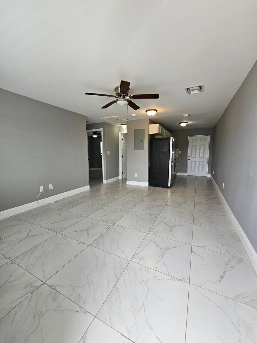 Freshly painted and fully renovated second-floor 2-bedroom unit in Riviera Beach. This updated residence features a modern kitchen with stainless steel appliances, granite countertops, and a private in-unit washer and dryer conveniently located in the laundry closet. Water included in rent. NO MINIMUN CREDIT SCORE REQUARIMENT! t. Do not miss this opportunity.
