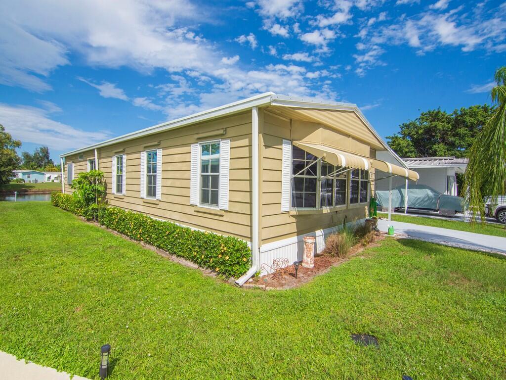Welcome to 17 El Morrow, a stunning manufactured home that redefines Florida living with style, comfort, and undeniable charm. Nestled in the sought-after 55+ community of Spanish Lakes Golf Village, this residence delivers the ''WOW'' factor from the moment you arrive with the open-concept living and dining areas perfect for entertaining and a gourmet kitchen featuring modern appliances, ample cabinetry, and sleek countertops. Home has a brand new metal roof and new tiedowns. The large Florida Room is ideal for morning coffee or evening cocktails. Updated bathrooms have elegant finishes and walk-in showers. The large primary bedroom overlooks the lake with plenty of closet space and natural light. The private outdoor space is a great place to relax and watch the wildlife.