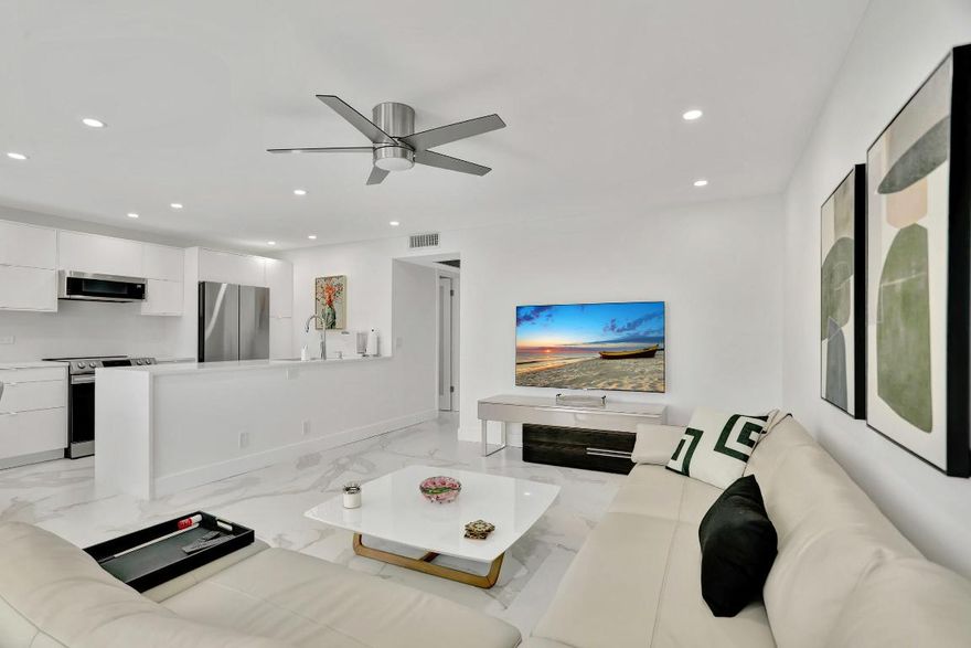 Brand-new luxury reno. Bright and airy 2/2 condo on the second floor. (Elevator).  State of the art appliances, quartz countertops and backsplash, porcelain tile floor, floor to ceiling, tile in both full bathrooms. New windows and doors, water heater and electrical panel. Newer air conditioner. Lots of closet and cupboard space. Large 200 square-foot sunroom with soothing lake view can also be used as additional space for office, sleeping, or even more storage. Perfectly situated far from traffic noise and steps from neighbourhood pools. Amenities include clubhouse with a huge array of clubs and activities, large swimming pool, theatre, tennis, pickle, ball, bocce, fully equipped gym, restaurant and free transportation throughout the community and popular neighborhood destination