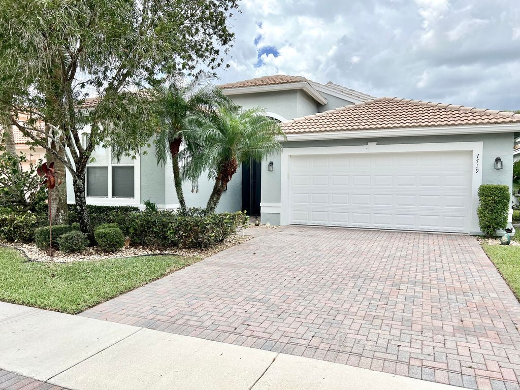 Photo of 7719 Ocean Sunset Drive Dr, Lake Worth Beach, FL 33467 (MLS # R10795734)