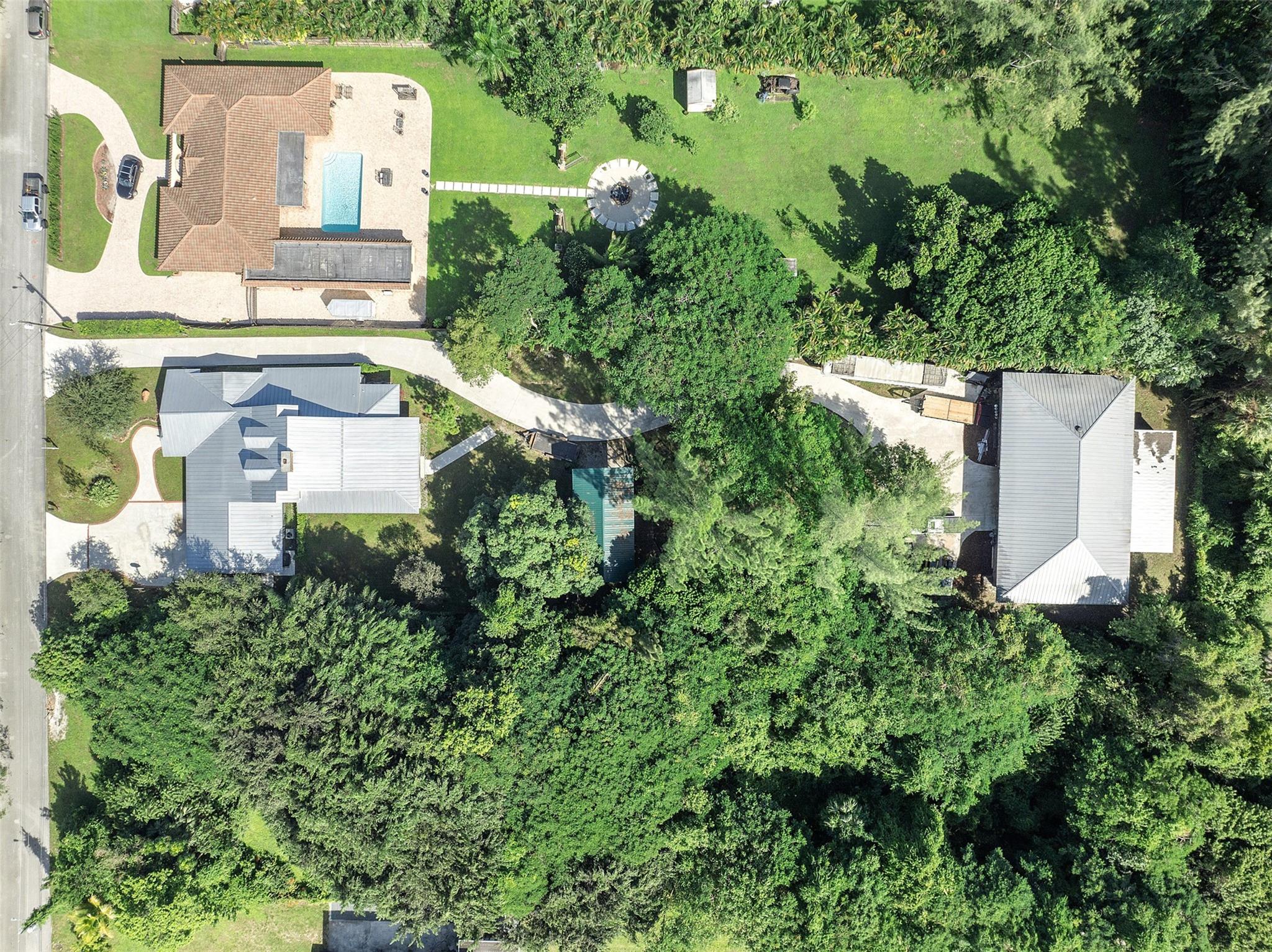 3400 SqFt HOME and 2900 SqFt GARAGE ON 1 ACRE IN PLANTATION. PRICE REDUCED
Very unique Property for the individual seeking plenty of space for their hobbies and family, while being just minutes from all the amenities you could ask for. Both house and garage are CBS construction, Spray Foam Insulation, Standing Seam Metal Roofs, and Impact Windows and Doors. House is two story with beautiful loft overlooking a large family room with vaulted ceilings and 2 sided fireplace opening to Great Room/Kitchen combo. This 4/3 has many extra rooms and tons of usable space. The detached garage features 14 ft ceilings, 2 12'X14' roll up doors, and 5 ton HVAC. All this in a Great Central Location - 15 min to FLL, 30 min to MIA, 40 min to PBI,<10 min to I95 and Fl TP. Downtown Ft Laud/Las Olas 15 min.