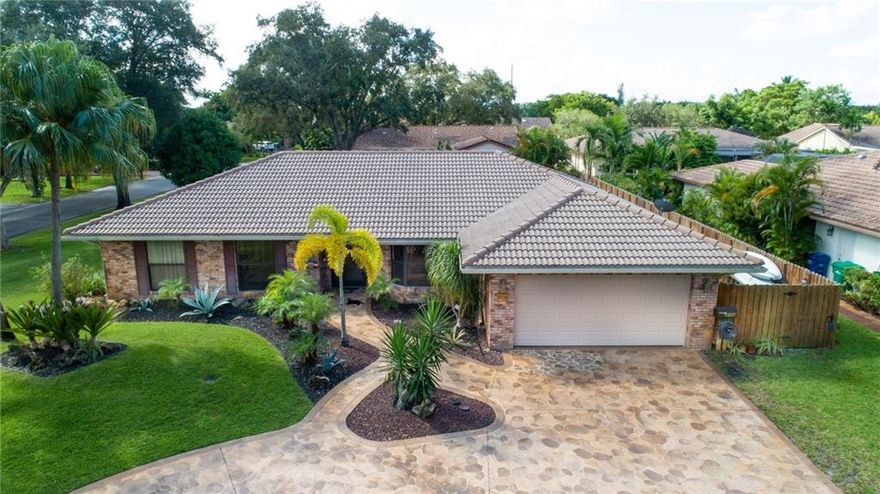 SELLERS MOTIVATED,PRICED LOWERED OVER 20K! Beautiful corner home located on oversized lot in highly sought after Shadow Wood!. This Amazing 4/2 home boasts gorgeous upgraded kitchen and baths, impact doors, windows, and shutters. Solar pool panels, dual AC, water softener and tankless water heater. Ample storage and walk-in closets. Secluded fenced yard, salt-water pool with screened enclosure, large covered patio, hot tub and custom tiki. Make this home a perfect paradise for entertaining. Homes like this do not come very often!