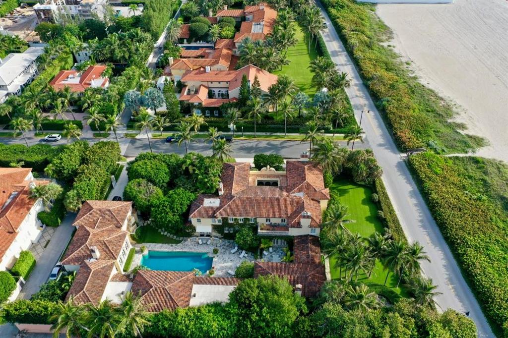 ICONIC Palm Beach | Rarely does one have the chance to purchase such an important estate on Palm Beach located on the corner of Main and Main. Built originally in 1926 by renowned Palm Beach architect Marion Sims Wyeth, La Salona exudes true Palm Beach style. When one enters the arched entry courtyard, you're swept back in time. Although originally built in 1926, the home has been completely updated under the current owner over the past 30 years. The most recent renovation of the western portion of the home was completed in 2016. The 2 stories include a 3-bedroom apartment on the first floor and another 3-bedroom apartment on the second floor. Distinctive features of the house include exquisite Cypress coffered ceilings, stenciled using a technique called lime paste.
