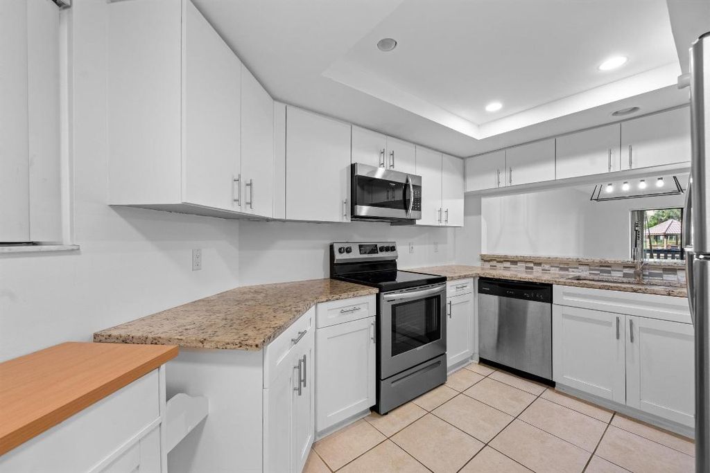 Photo of 600 Uno Lago Drive #104, Juno Beach, FL 33408 (MLS # R11145545)