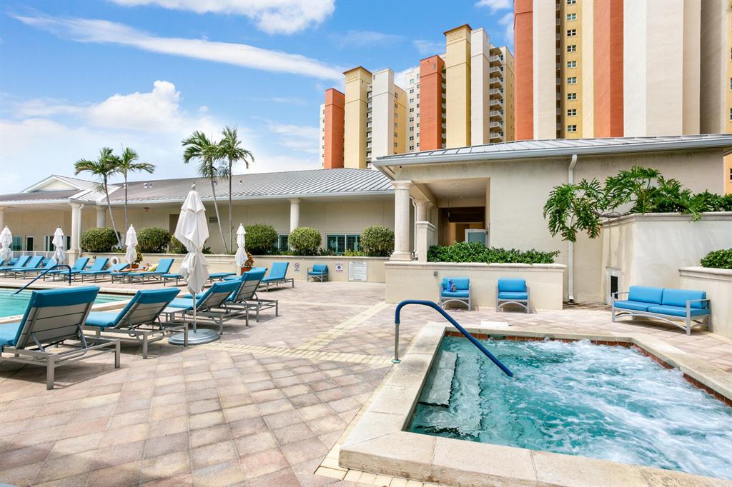 Direct Intracoastal with spacious rooms and spectacular view. 2 bedroom, 2.5 bath with open kitchen, floor to ceiling sliding glass doors and windows with expansive open-air balcony with glass panel railings. Marina Grande rises from the water and towers over a breathtaking panoramic view of the Intracoastal Waterway, Singer Island, and beyond to the Atlantic Ocean. All the amenities that resort living has to offer - waterfront lobbies, steam and sauna rooms, fully equipped fitness center, private billiards room, card room with tournament-style poker table, large rooftop pool overlooking panoramic views of the Intracoastal Waterway. Valet parking. Coastal living at its finest!