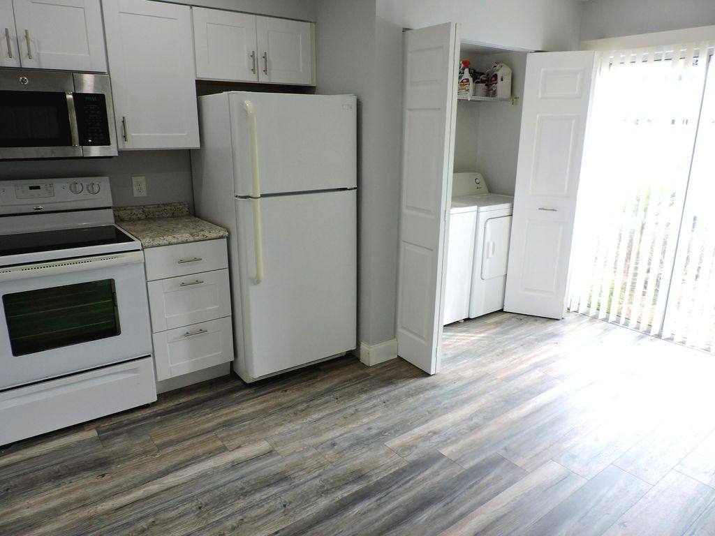 Photo of 6198 Riverwalk Lane #7, Jupiter, FL 33458 (MLS # B26007071)