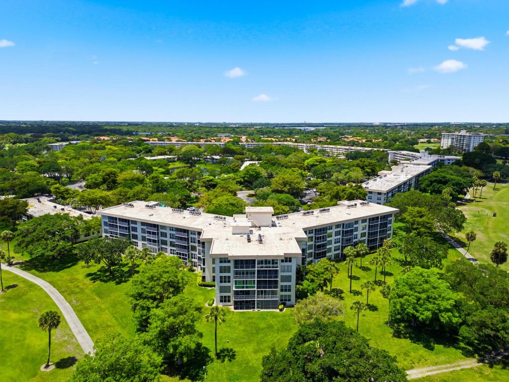 Photo of 3800 Oaks Clubhouse Drive #106, Pompano Beach, FL 33069 (MLS # B26021937)
