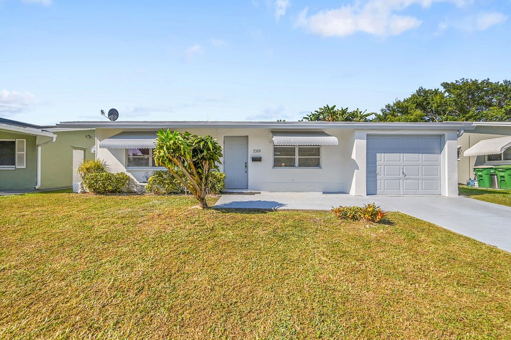 Photo of 5309 NW 49TH Avenue, Tamarac, FL 33319 (MLS # B26093626)