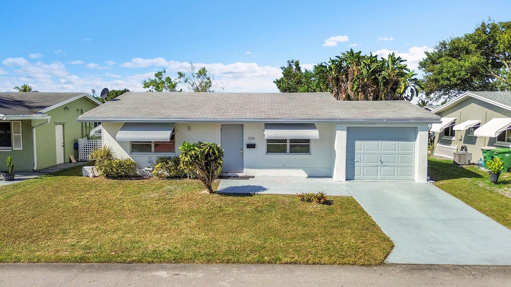 Photo of 5309 NW 49TH Avenue, Tamarac, FL 33319 (MLS # B26093626)