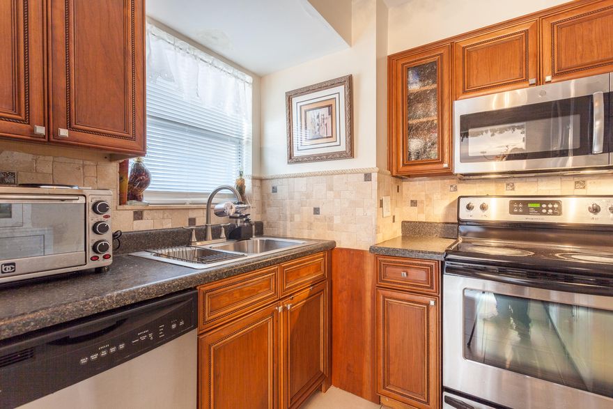 Located in highly convenient Palm Springs, this 2BR/2BA renovated ground floor condo features head-to-toe renovations. This unit offers a completely new kitchen with new cabinets, counter-tops, and backsplash, plus a new stove, dishwasher, and refrigerator.  Both bathrooms have also been fully remodeled. Plus, new porcelain tiles and premium laminate wood flooring have been installed throughout the entire unit. The living/dining room is roomy and provides direct access to a fully screened-in patio that overlooks a canal for extra privacy. The air conditioner is also updated. Finally, the master bedroom has a huge walk-in closet and a beautiful bath. With all the renovations, this unit looks like a new model home. Hurry, this can't last long!