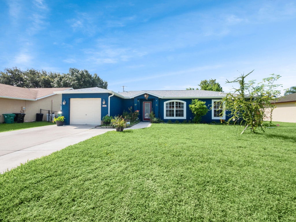 Photo of 1342 SW Wampler Avenue, Port Saint Lucie, FL 34953 (MLS # R11011721)