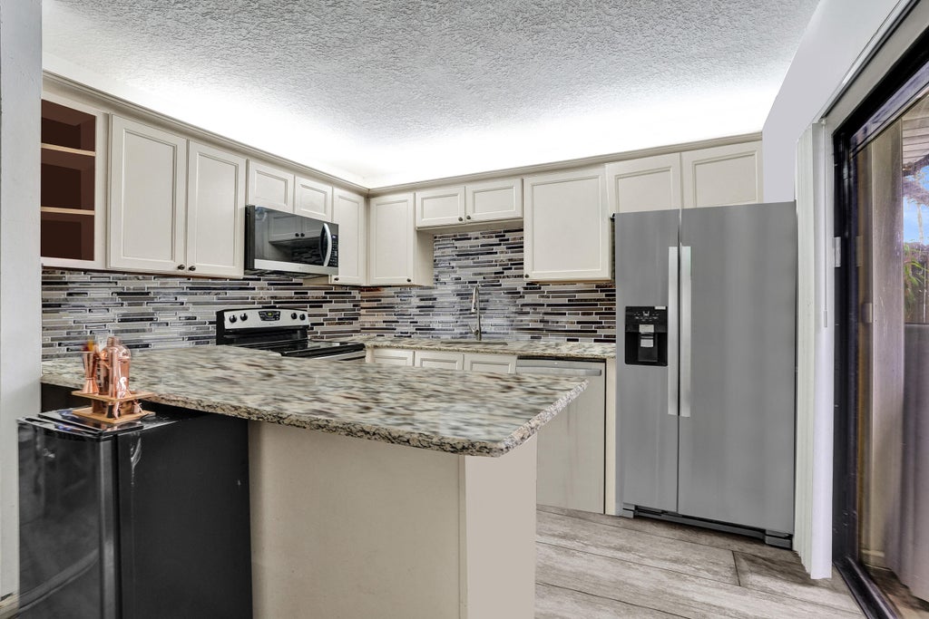 Photo of 9993 NW 7TH Street, Plantation, FL 33324 (MLS # B26070517)