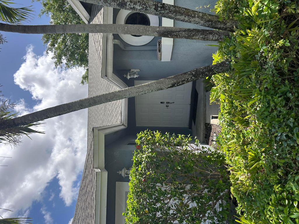 Photo of 5124 NW 42nd Terrace, Coconut Creek, FL 33073 (MLS # B26013732)