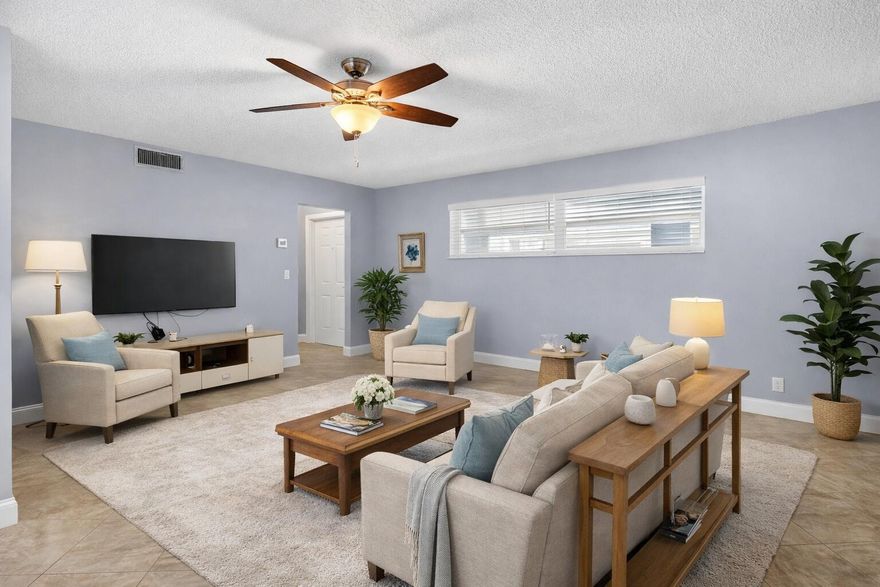 Enjoy comfortable living in this well-maintained 1-bedroom, 1.5-bath home offering 950 sq ft in a desirable 55+  community. The open living and dining area creates a welcoming space to relax or entertain, complemented by neutral finishes and easy-care tile flooring. The spacious bedroom features an en-suite bath, while the additional half bath is ideal for guests.  A glass-enclosed patio overlooking the garden provides a peaceful spot to enjoy morning coffee or unwind in the evening.  This home offers a simple, low-maintenance lifestyle perfect for full-time living. Residents enjoy a peaceful community atmosphere with convenient access to nearby shopping, dining, and recreation. Furniture is optional, providing a great move-in-ready opportunity.