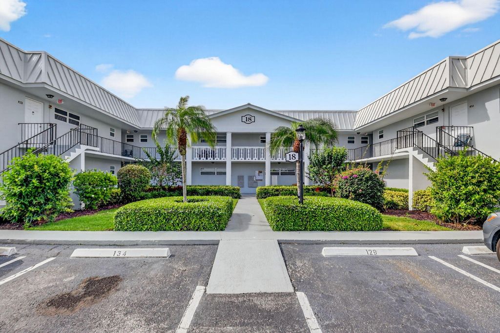 Photo of 18 Colonial Club Drive #203, Boynton Beach, FL 33435 (MLS # B26000624)