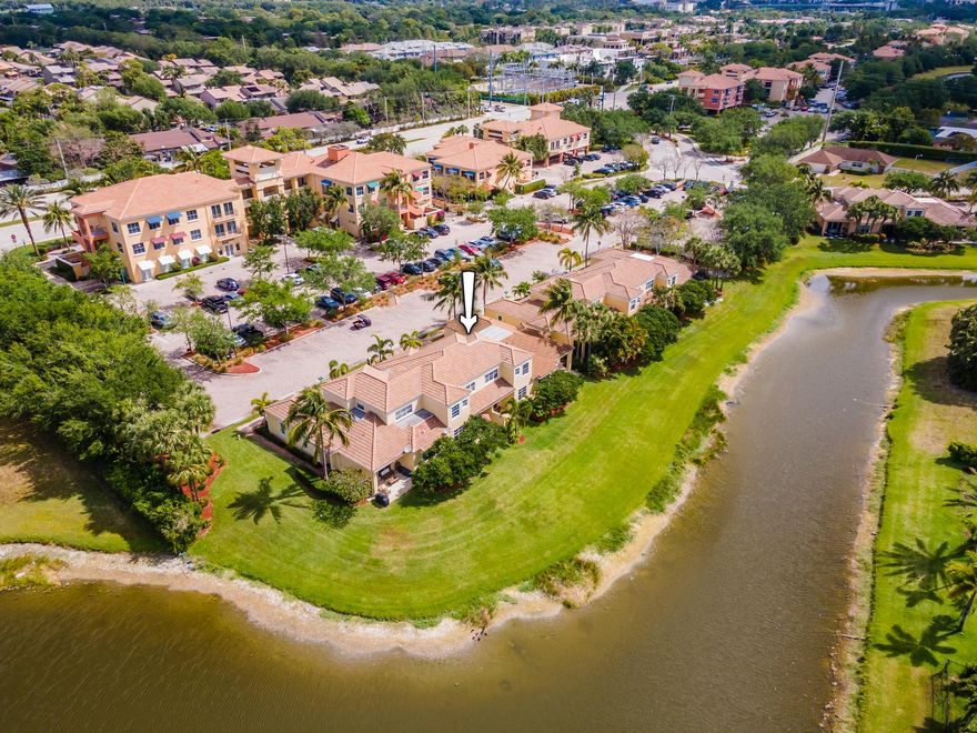 This modern 2BR/2BA townhome has been immaculately updated with careful attention to detail throughout and offers a sought-after garage space. Located on a small, picturesque lake, the home has been freshly painted and offers bright & roomy living spaces including an open concept kitchen with granite countertops & backsplash, Stainless Steel appliances, white cabinets, an under-mount sink, plus an 'eat at island' counter area. The living and dining areas have beautiful lake views, and there's an open patio with brick pavers with those same gorgeous views. Step out of your front door and walk to great restaurants & bars such as Rocco's Taco's, Panera Bread, Spotos, etc. Plus you're close to the beach, the Gardens Mall, Trader Joes, and conveniently between I-95 and the Turnpike. 2021 - AC, both condenser & handler 
2023 - Interior Paint Through out
2023 - Epoxy Garage Floor
2023 - Primary Bath Frameless Shower
2023 - Grout painted and sealed
2023 - New lighting fixtures in living and bathrooms
2023 - Ring Security system including Video, motion and door sensors
2019 - Nest  "smart" WiFi AC thermostat