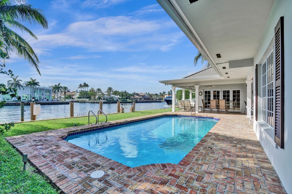 Photo of 7 Saranac Road, Sea Ranch Lakes, FL 33308 (MLS # B26014128)