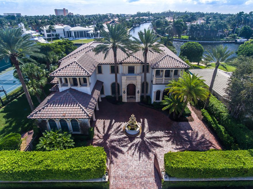 Royal Palm Grand Canal deepwater estate sited on 91 +/- feet of premier southeast waterfrontage on widewater intersecting canals & fabulous Intracoastal view.  An elegant Palm Beach-inspired mansion.  Resort-style pool/patio is a perfect venue for entertaining.