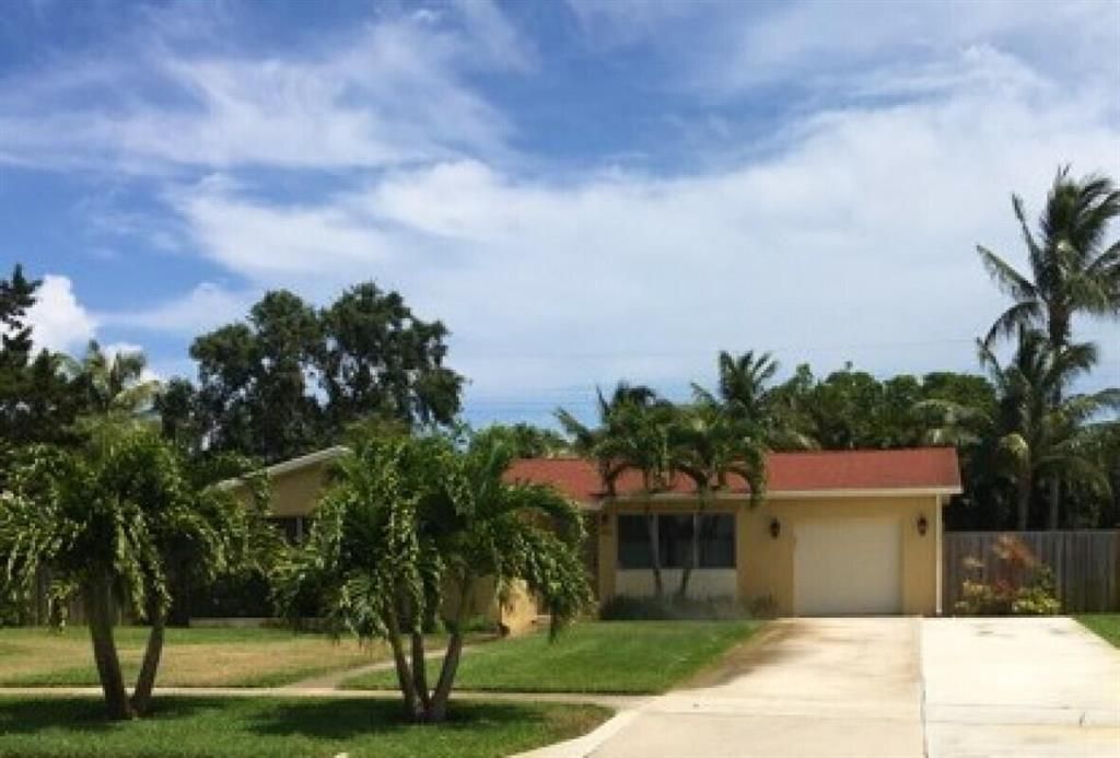 Photo of 430 Crescent Drive, Lake Park, FL 33403 (MLS # R10797725)