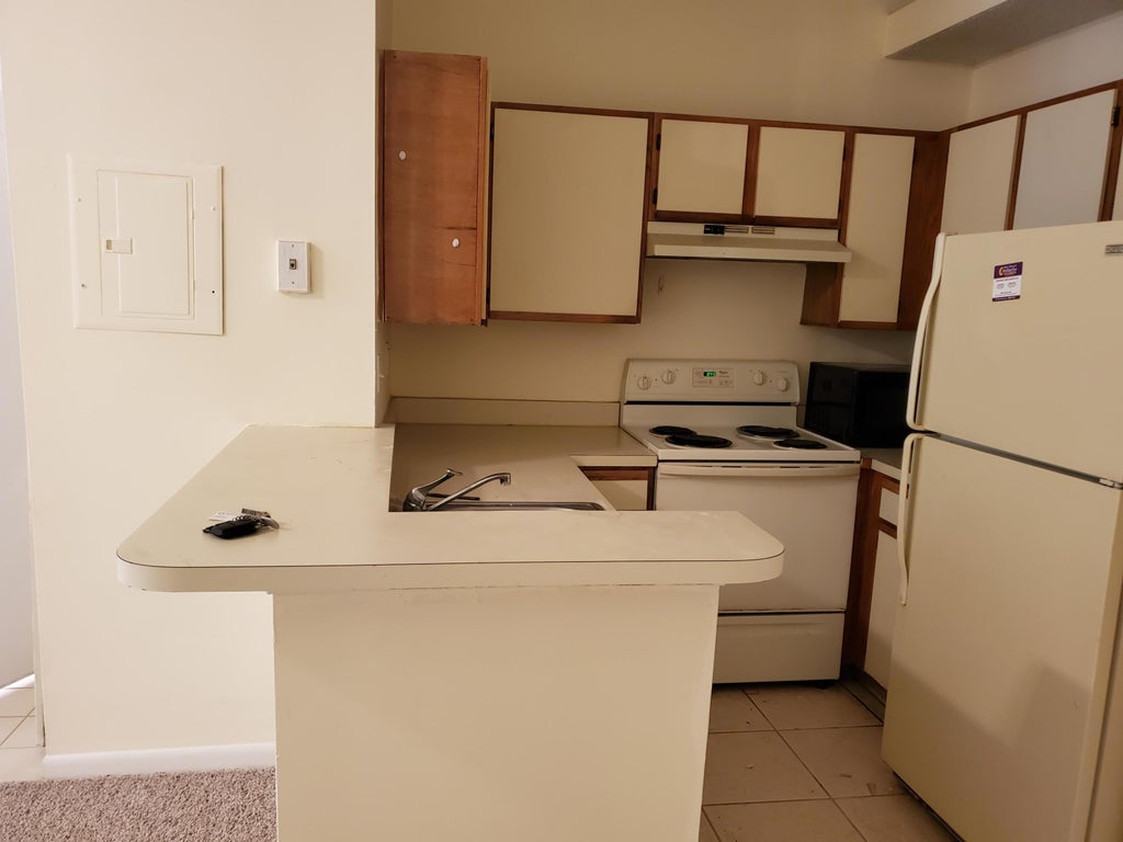 Photo of 851 Lyons Road #22203, Coconut Creek, FL 33063 (MLS # B26071124)