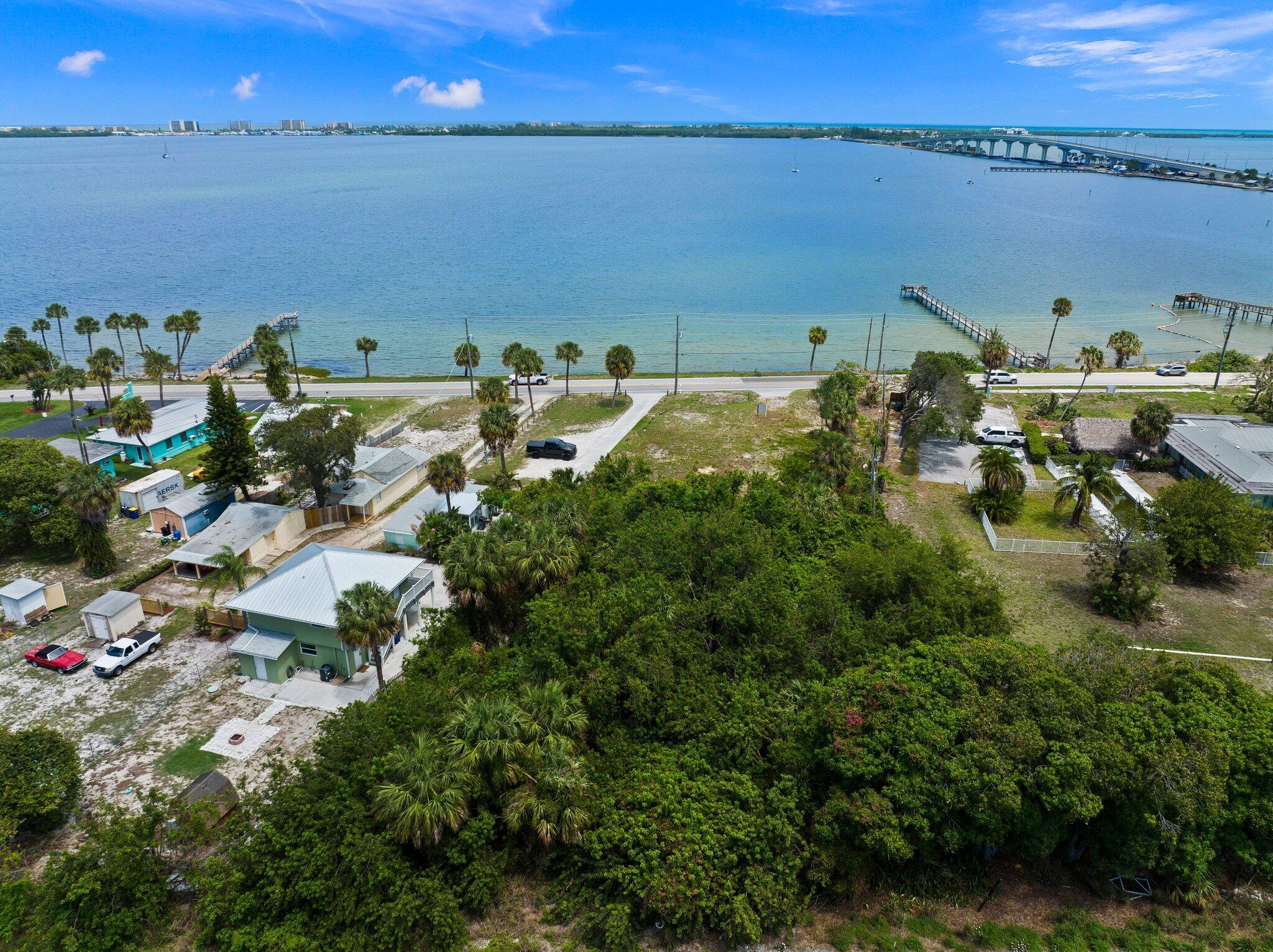 Rare waterfront lot with spectacular unobstructed views. Over 100 ft of Frontage with Riparian Rights. Less than a mile to shopping, dining, boat ramps, fishing pier, downtown, & the beach. Zoned R-3A with future Residential or Limited Commercial use. This .71 acre property extends well beyond the tree line. It is one of the few vacant waterfront parcels in Martin County, with proximity to Jensen Beach Business District and the causeway. Ideal for building a commercial investment property or your dream home. Public water & sewer available, along with excellent schools. Dont miss out on this rare investment opportunity.
