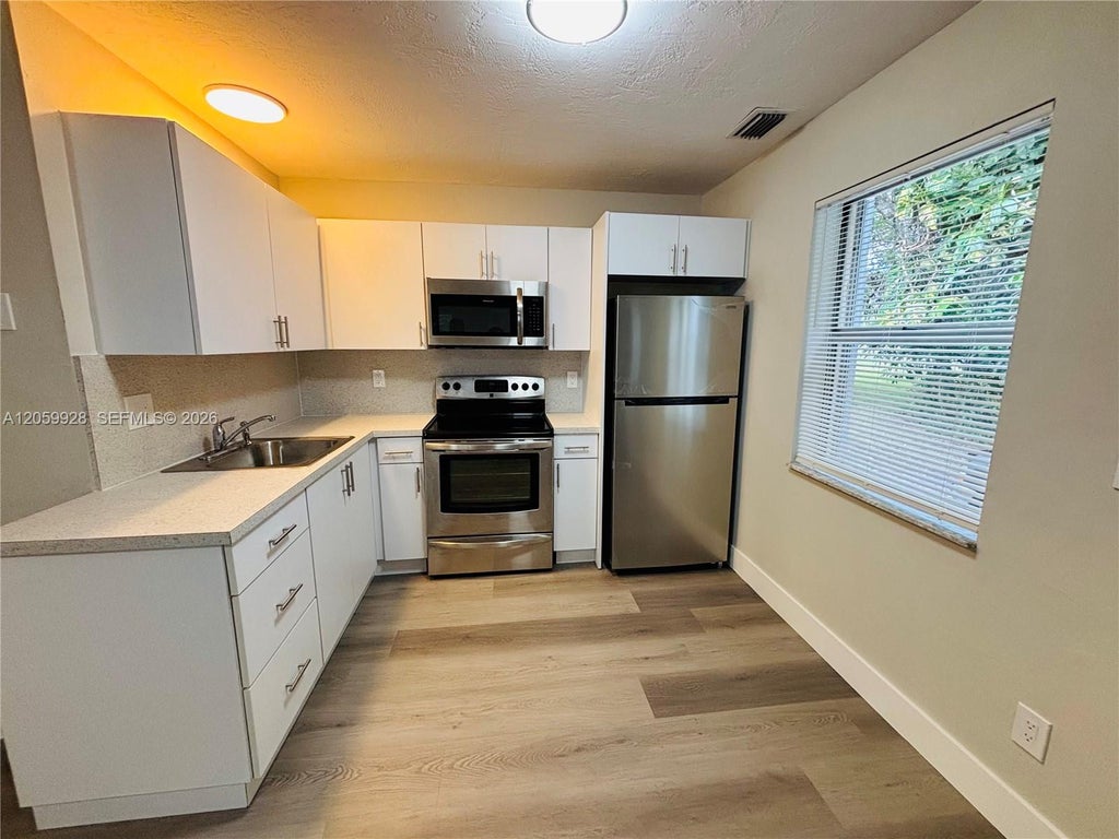 Photo of 1011 SW 8th Street #D, Hallandale Beach, FL 33009 (MLS # A12059928)