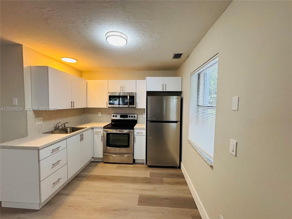 Photo of 1011 SW 8th Street #D, Hallandale Beach, FL 33009 (MLS # A12059928)